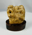 Ancient Egyptian limestone baboon fragment representing Thoth in stylized form.