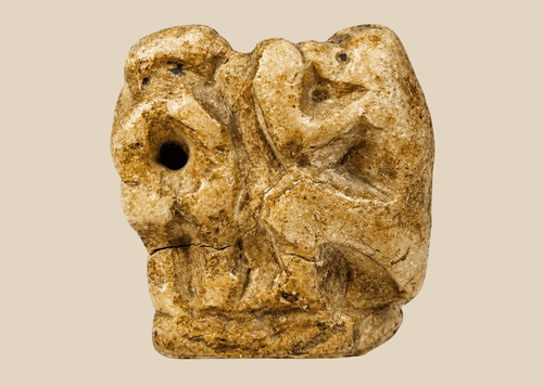 Ancient Egyptian carved limestone baboon figure associated with the god Thoth from the Late Period.