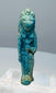 Detail of the transverse suspension hole on an Egyptian Sekhmet or Bastet amulet