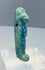 Small mold-formed Egyptian faience figure with burial deposits and turquoise glaze