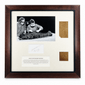 Front view of framed Egyptian mummy-wrapping fragments with a historic photograph, handwritten inscription and identification panel.