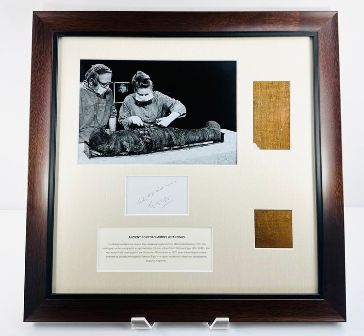 Mounted Egyptian linen fragments with a black-and-white investigation photograph and inscription attributed to Dr. Edmund Tapp.