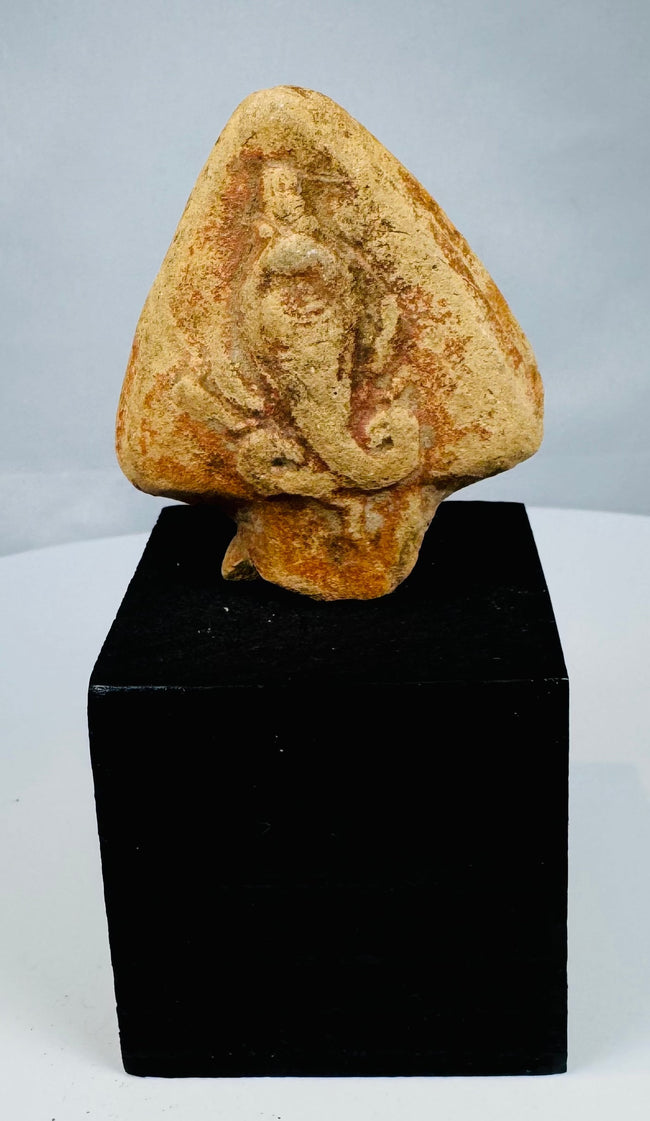 Ancient Egyptian serpent relief with curved body and hood-like background
