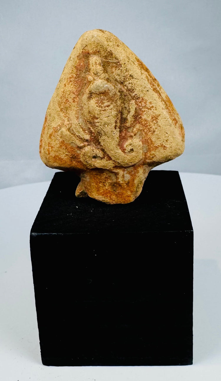 Ancient Egyptian serpent relief with curved body and hood-like background