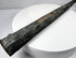 Wooden scabbard liner with two irregular openings separated by a central section of wood.