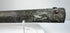 Decorated metal scabbard with botanical scrollwork and raised dotted borders.