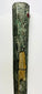 Vertical view of upper Etruscan bronze sword sheath with intricate carvings, gemstone inlay, and bronze patina – early Iron Age artifact
