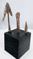 Three archaeological iron projectile heads including tanged and barbed forms