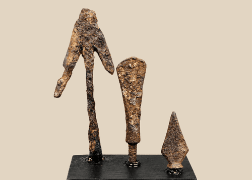 Group of three ancient and medieval iron projectile points on black display bases
