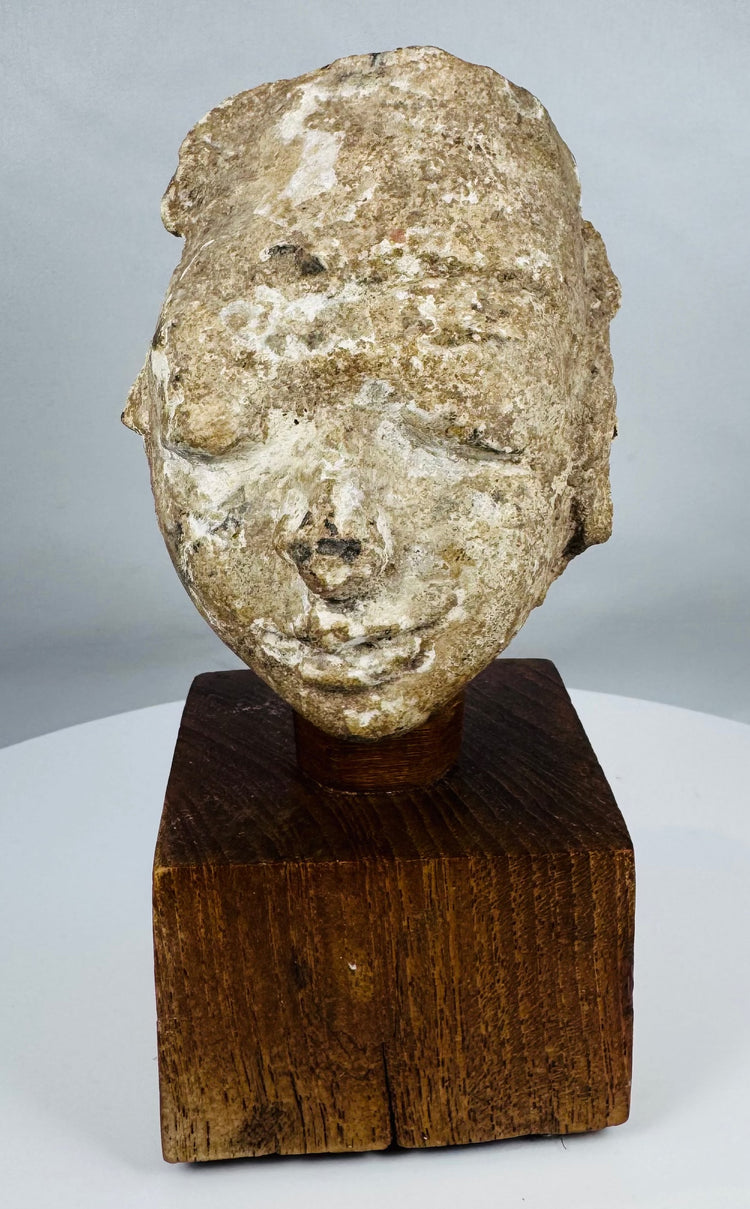 Ancient Buddhist stucco head fragment from the Kushan to Post-Kushan period