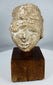 Ancient Buddhist stucco head fragment from the Kushan to Post-Kushan period