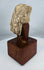 Weathered stucco head from ancient Gandhara with mineral deposits and age-related wear