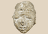 Ancient Gandharan Buddhist stucco head fragment mounted on a wooden display base