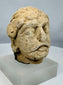 Rare Gandharan limestone fragment traditionally identified as Maitreya, showcasing the fusion of Greek, Roman, and Indian artistic styles.