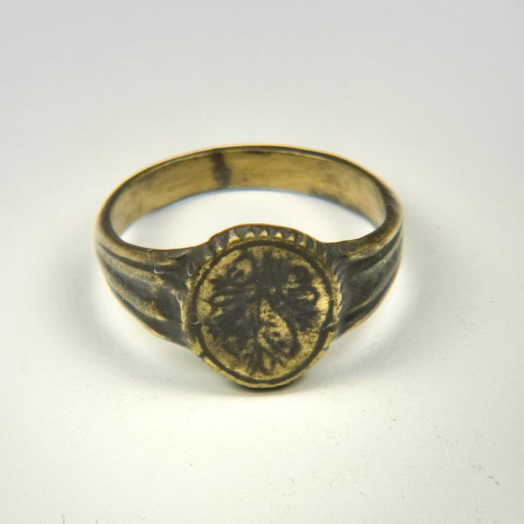 Ancient gold-gilded bronze signet ring with engraved floral motif, circa 300–600 CE