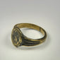 Ancient Eastern Mediterranean signet ring featuring an engraved floral motif and natural patina