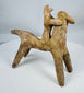 Boeotian terracotta horse and rider votive sculpture from ancient Greece with traces of original red pigment.