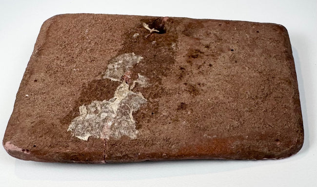 Shunga to Kushana period terracotta plaque from India depicting a large feline in profile with impressed body markings.