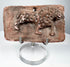 Early Historic Indian terracotta feline plaque with curled tail, suspension hole, and aged reddish surface.