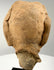 Rear view of ancient terracotta head fragment showing smooth skull back and jagged break