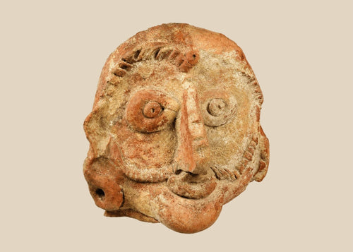 Shunga period terracotta head, 2nd–1st century BCE, with naturalistic facial features, red terracotta surface, and subtle stylization.