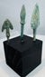 Compact winged bronze arrowhead with swallow-like shoulders and heavy mineral patination