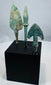 Broad leaf-shaped bronze projectile point with flat tang and green archaeological patina