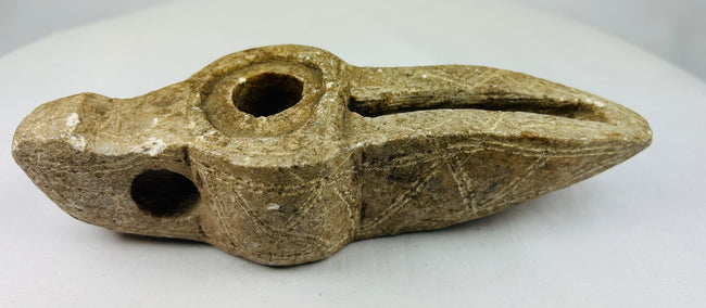 Middle Eastern carved stone lamp showing authentic archaeological surface