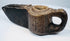 Ancient carved stone lamp from the Islamic world with geometric detailing and a projecting spout designed for a wick.