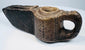 Ancient carved stone lamp from the Islamic world with geometric detailing and a projecting spout designed for a wick.