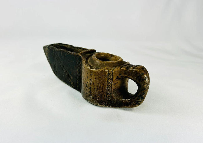 Early Islamic hand-carved stone oil lamp, 7th–12th century CE