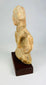 Side view of a Mauryan era terracotta figure highlighting form and proportions
