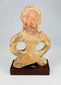 Museum-style photograph of an ancient Mauryan terracotta sculpture
