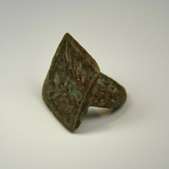 Historic bronze ring with legible twin bird engraving, square bezel, and centuries-old green patina