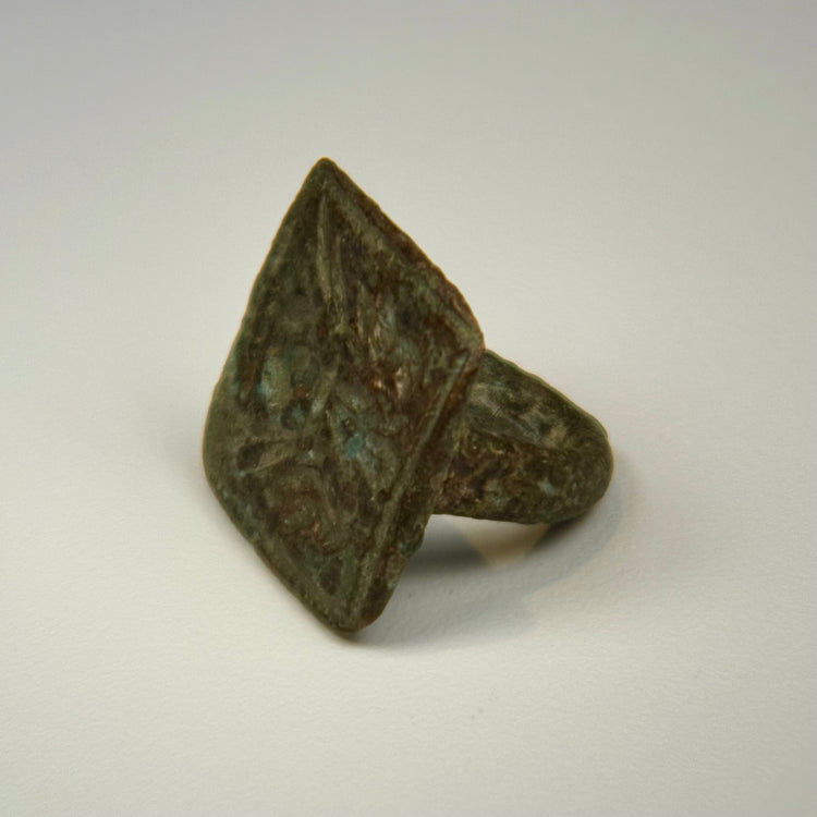 Historic bronze ring with legible twin bird engraving, square bezel, and centuries-old green patina