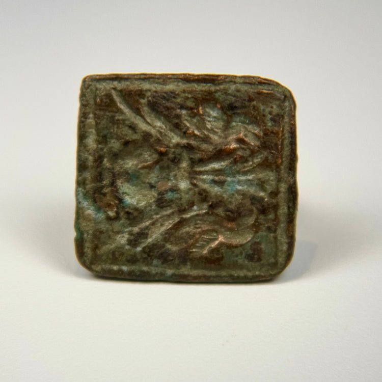 Mediterranean bronze finger ring featuring two engraved birds on a square bezel