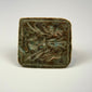 Mediterranean bronze finger ring featuring two engraved birds on a square bezel