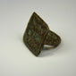 Ancient symbolic bronze ring featuring two birds representing harmony and companionship