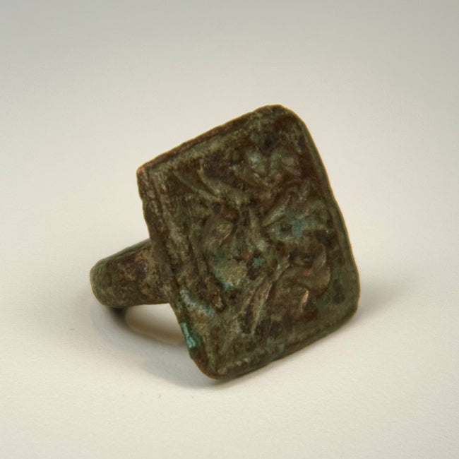 Ancient cast bronze ring with twin bird engraving and naturally developed green patina