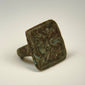 Ancient cast bronze ring with twin bird engraving and naturally developed green patina