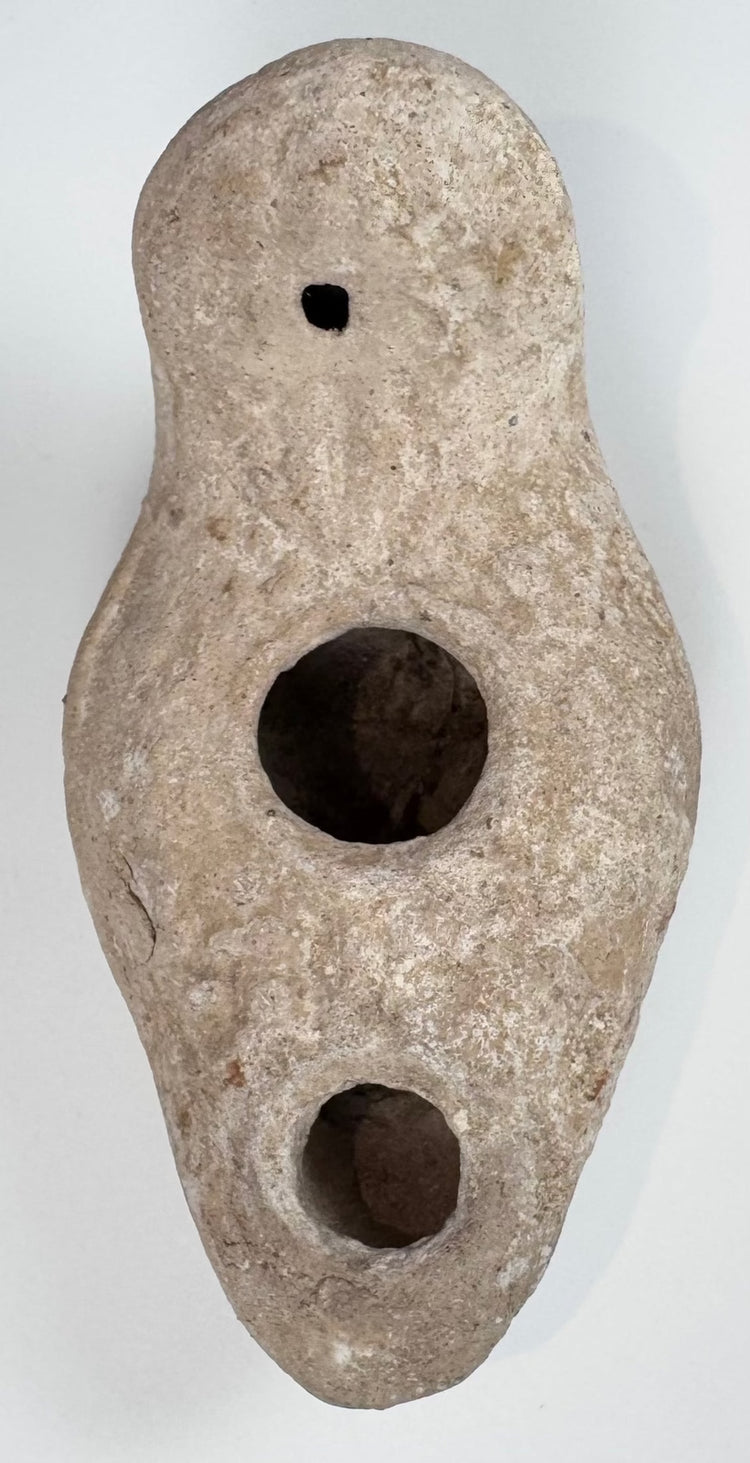 Near Eastern terracotta oil lamp with rounded enclosed reservoir