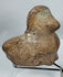 Classical Mediterranean earthenware bust fragment featuring almond-shaped eyes and softly modeled facial features.