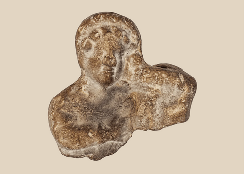 Ancient Classical Mediterranean terracotta figural bust fragment dating from the Hellenistic to Roman period.