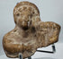 Ancient terracotta devotional figurine fragment with hollow mold-made construction and surviving upper torso.