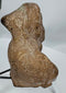 Rear view of an ancient mold-made terracotta figural fragment showing hollow ceramic construction.