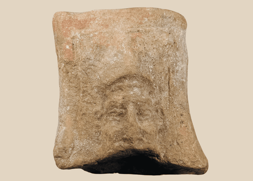 Ancient Hellenistic-Roman terracotta relief fragment depicting a mature male face
