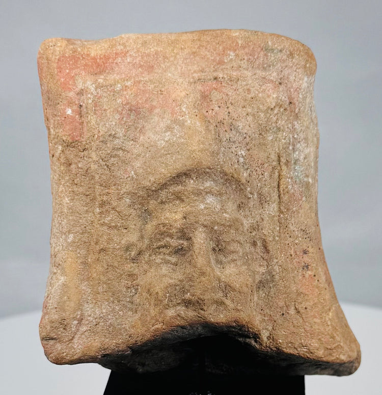 Mold-made Mediterranean terracotta plaque with frontal bearded male portrait