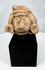 Pre-Columbian anthropomorphic stone fragment mounted on a custom display stand