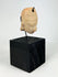 Pre-Columbian terracotta head pendant with drilled suspension hole