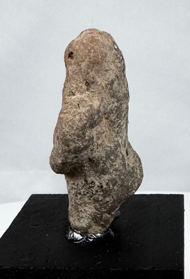 Pre-Columbian ritual stone effigy displaying substantial age patina and mineral deposits